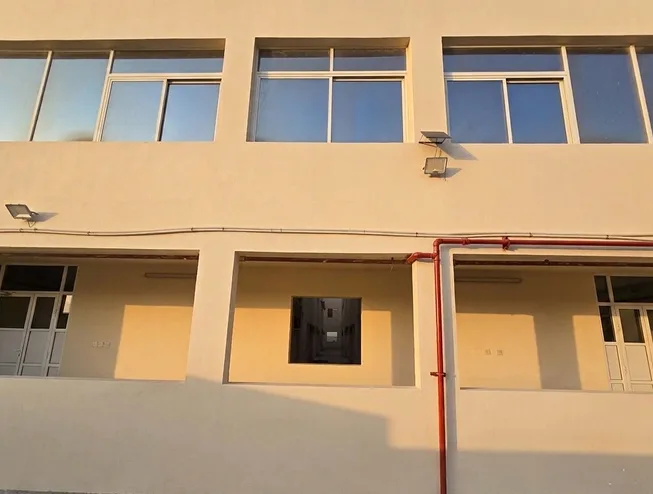 Gated courier accommodation building exterior near the delivery hub